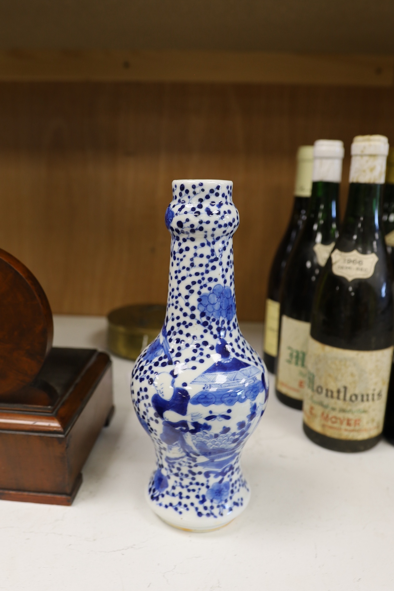 A Chinese blue and white 'boys' bottle vase, Kangxi mark but 19th century, 26cm high. Condition - good